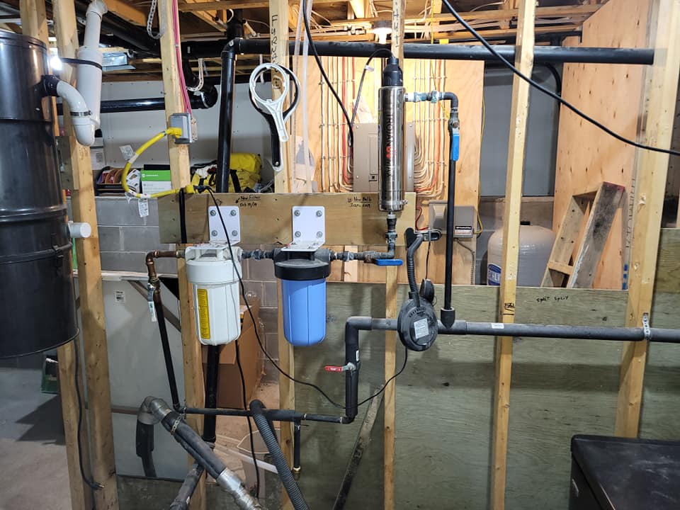 Water filtration and plumbing system installation